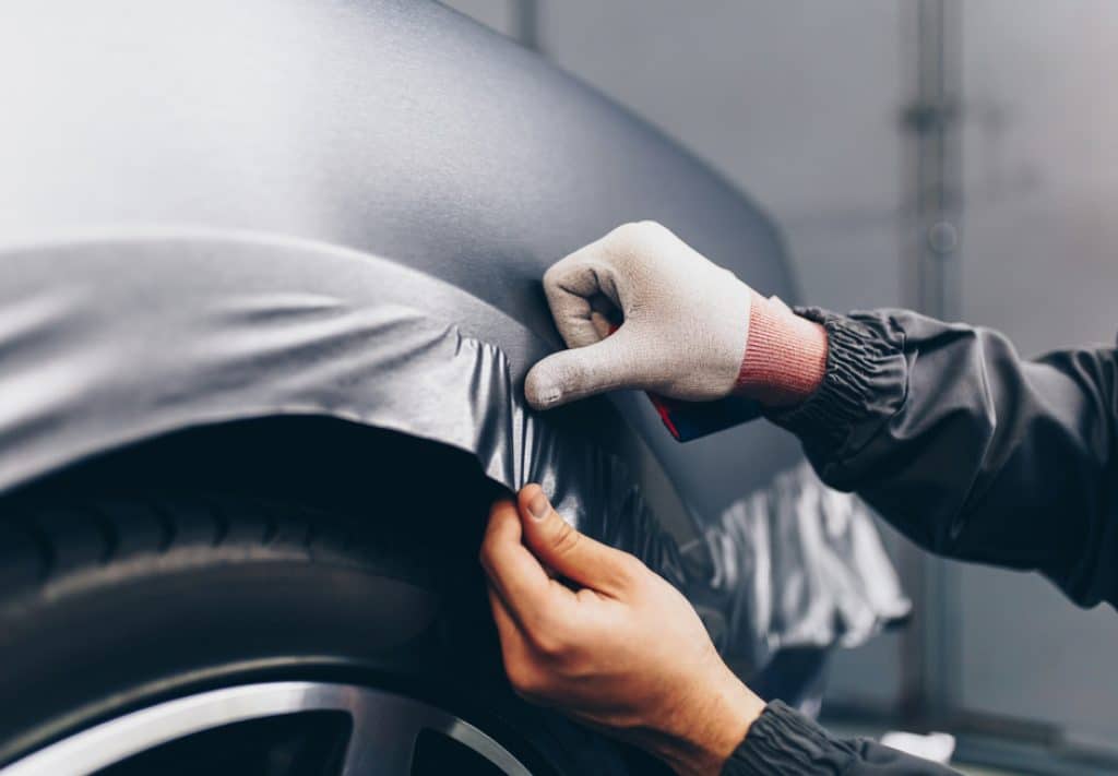 car wrap being applied, they usually last 5-7 years