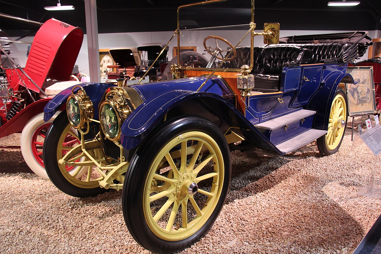 Blue 1910 Oldsmobile Limited touring car displayed at a museum
