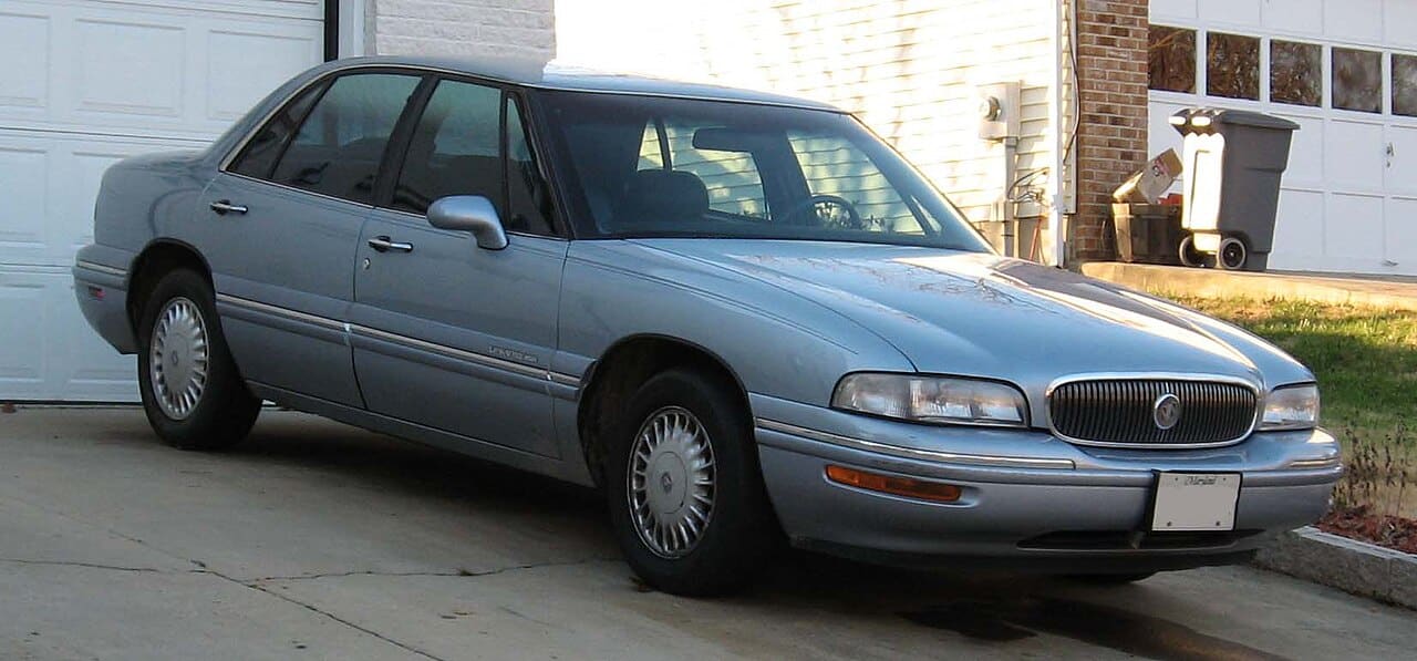 Light blue 1997 to 1999 Buick LeSabre sedan parked in a driveway