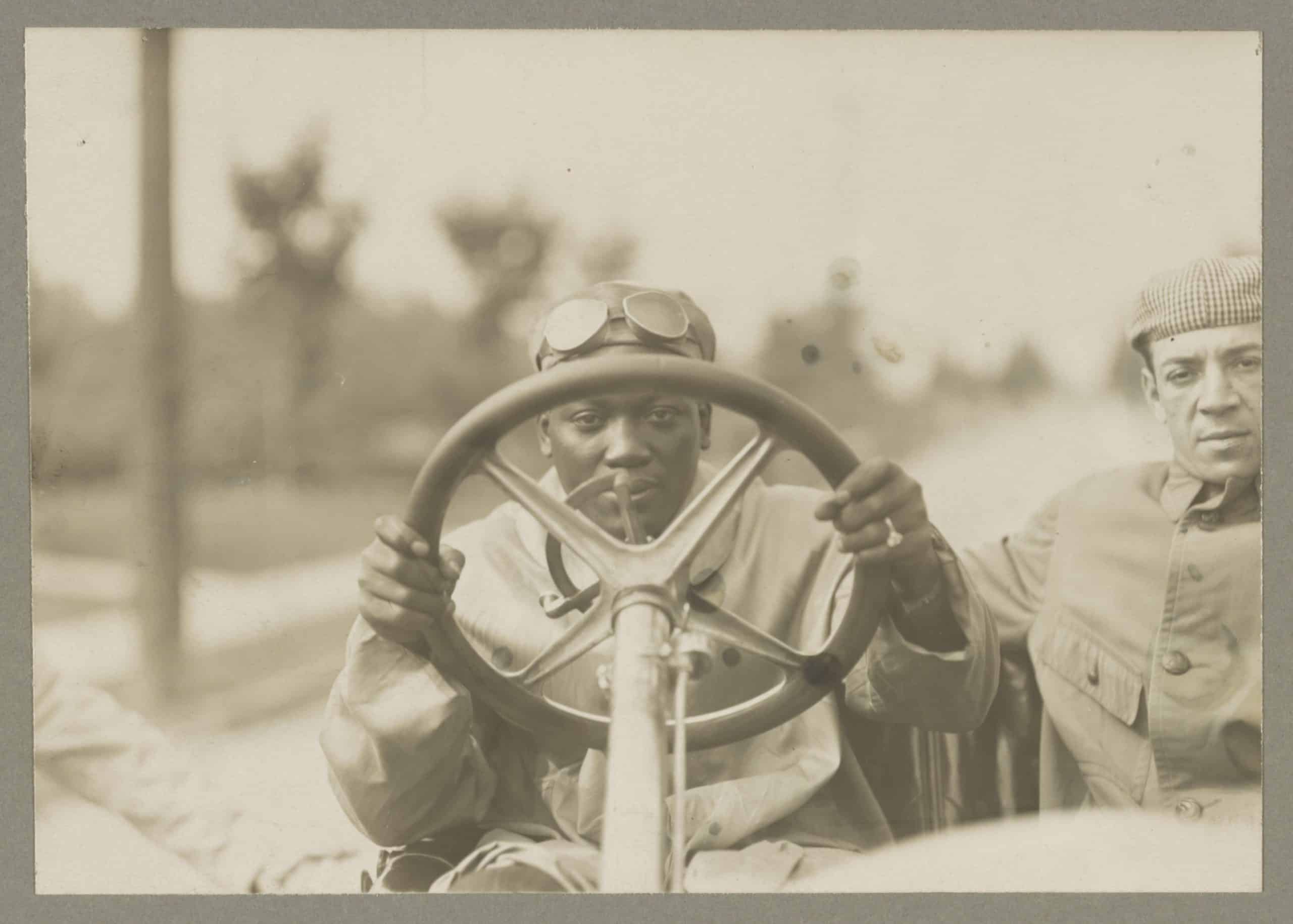 Boxer Jack Johnson seated in a Thomas Flyer in 1910