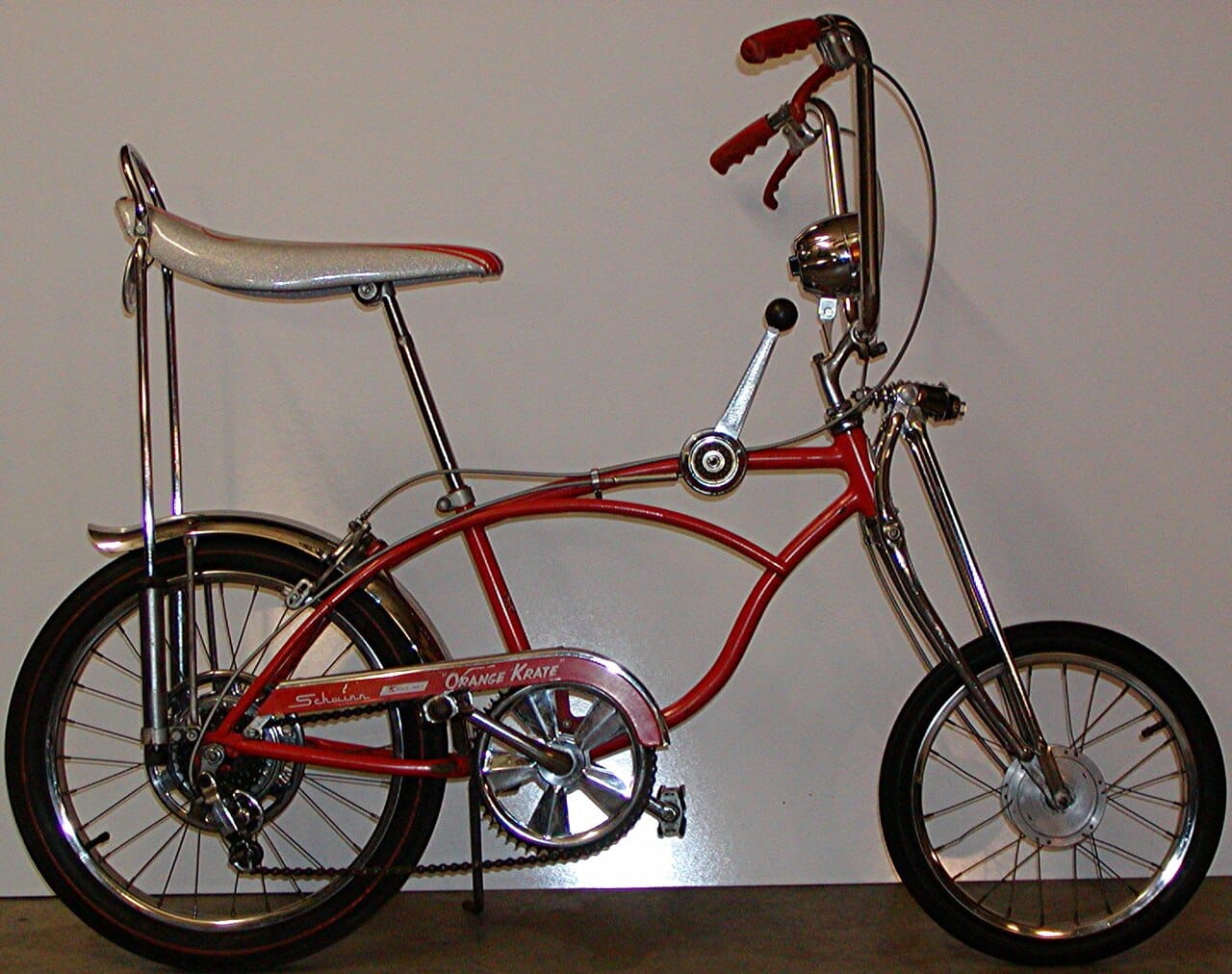 Orange 1968 Schwinn Sting-Ray Orange Krate bicycle with banana seat and high handlebars
