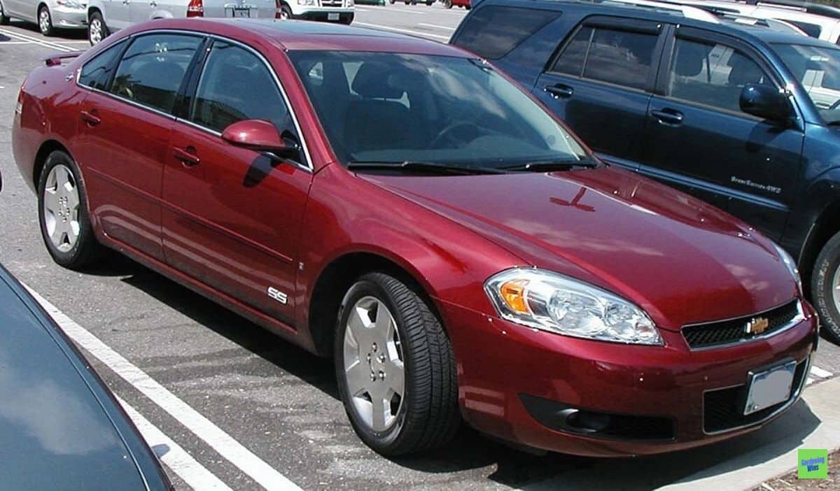 Red Chevrolet Impala SS with an SS badge on its front door