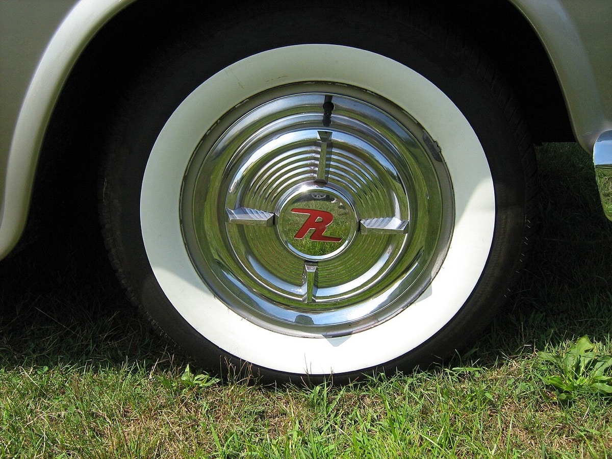 Original-style spinner wheel cover on a 1957 Rambler Rebel