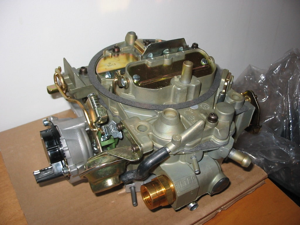 Rochester Quadrajet carburetor with its choke and linkage visible