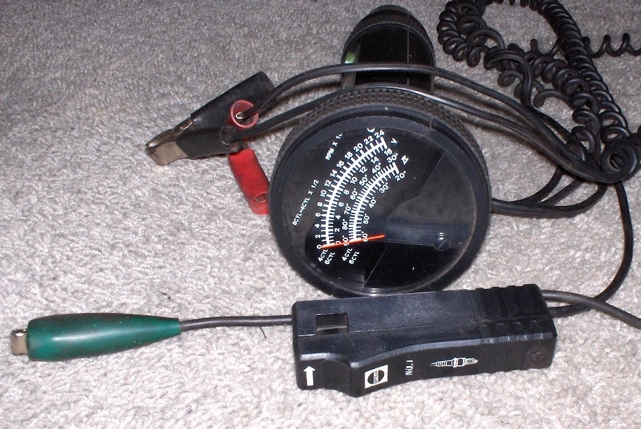 Timing light and analog dwell meter with their connection leads