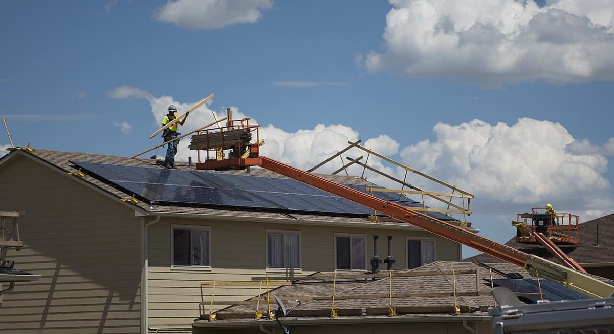 Roofing crew replacing shingles on housing in Colorado