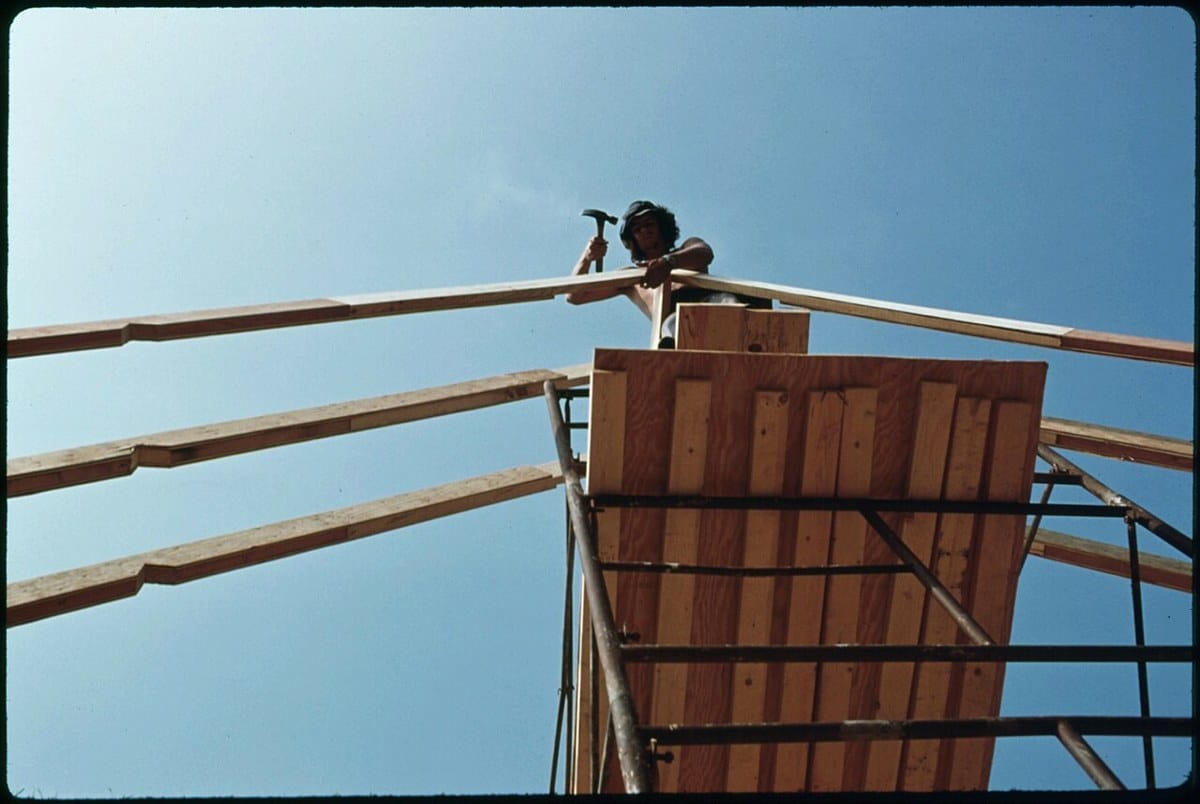 Carpenter working on a building frame in Helen, Georgia, in 1975