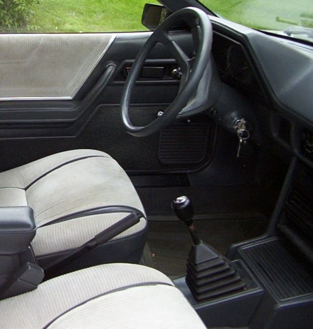 Manual gear lever and steering wheel in a 1984 Dodge Rampage