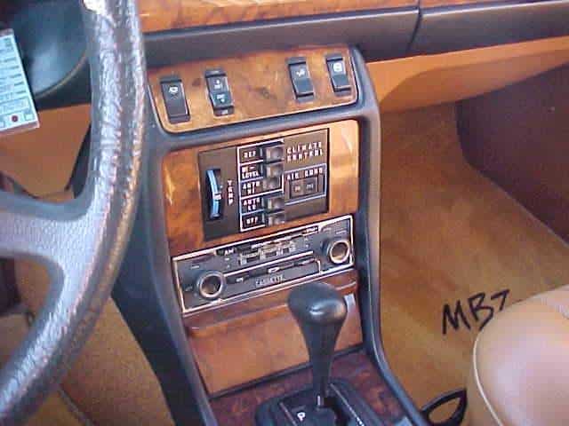 Physical climate buttons and Becker radio knobs in a Mercedes-Benz W123