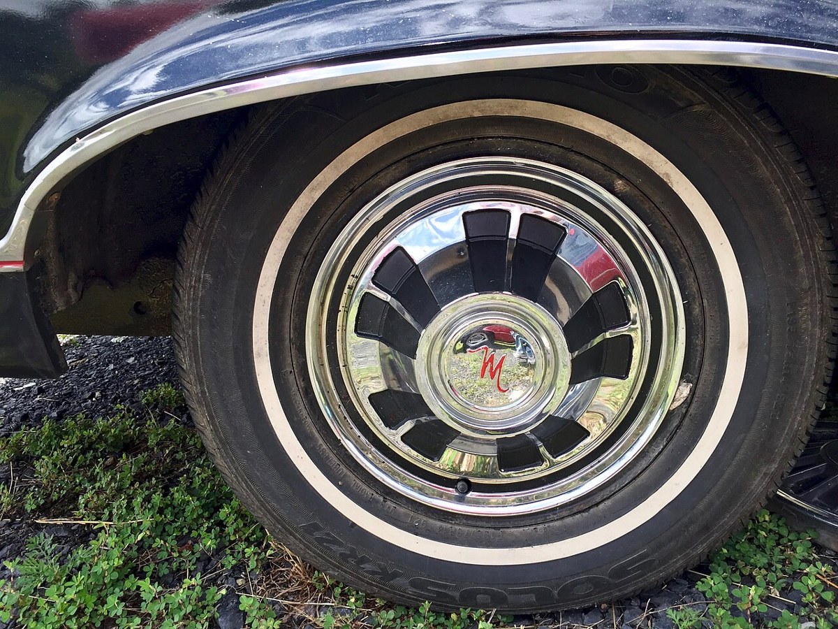 Whitewall tire and wheel cover on a 1967 AMC Marlin