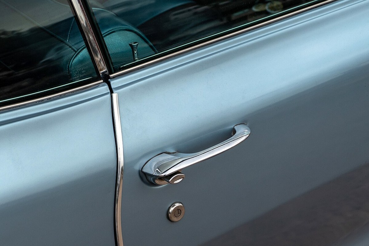 Chrome push-button exterior door handle on a 1965 Pontiac Bonneville