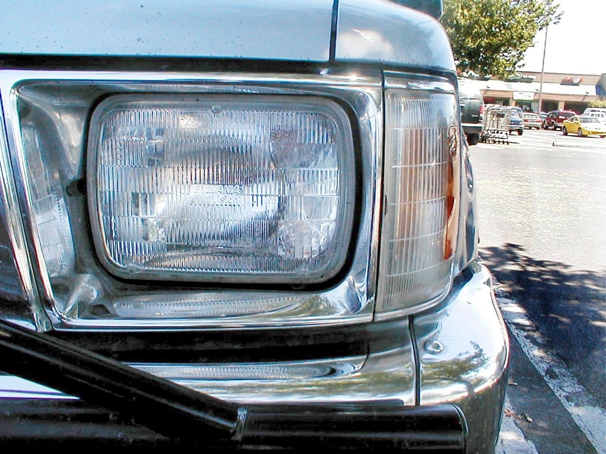 Rectangular Sylvania sealed-beam headlamp and its surrounding trim