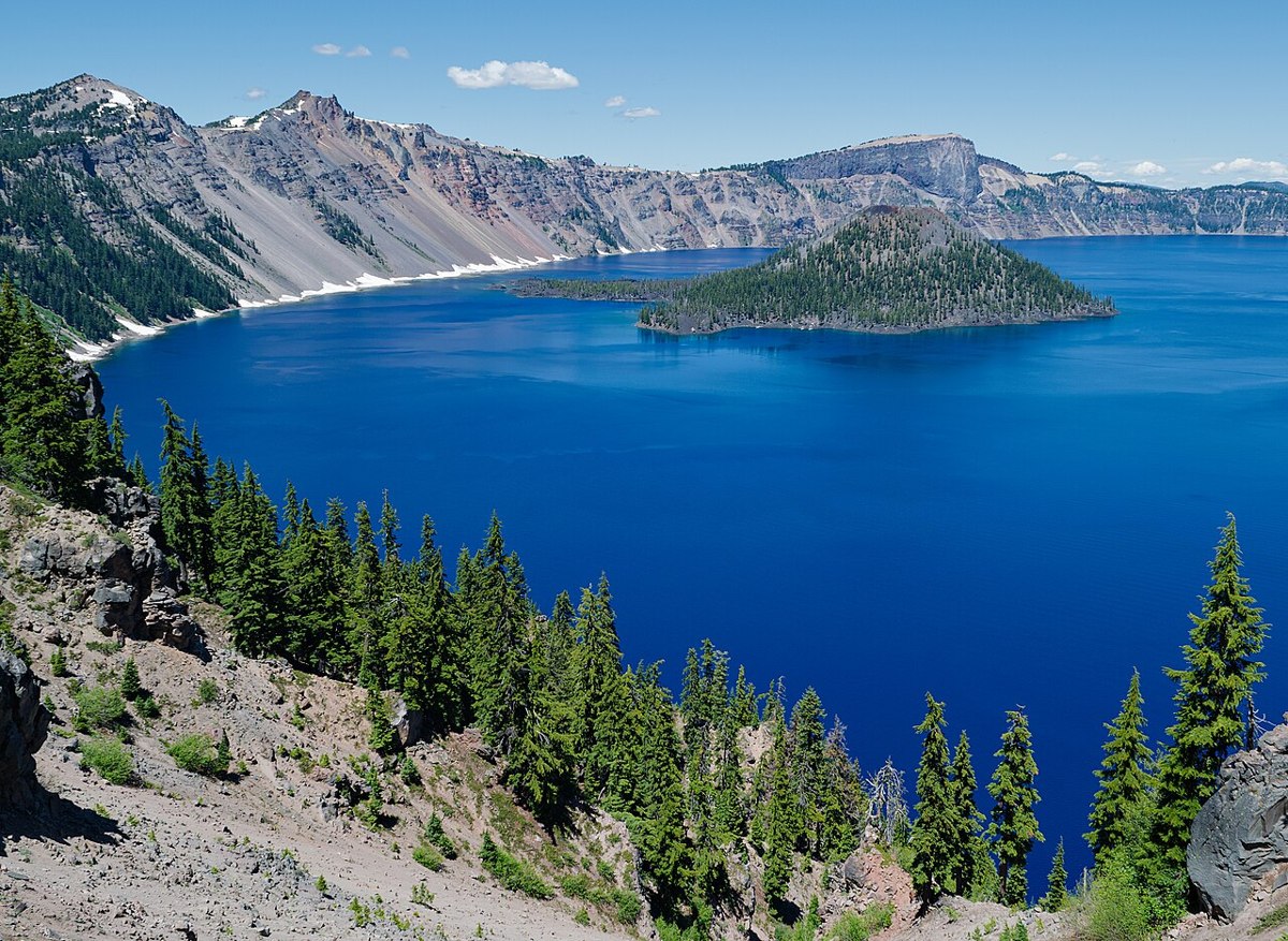 Wizard Island surrounded by blue Crater Lake
