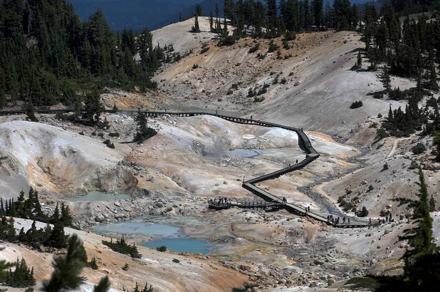 Wooden boardwalk through the pale Bumpass Hell hydrothermal basin