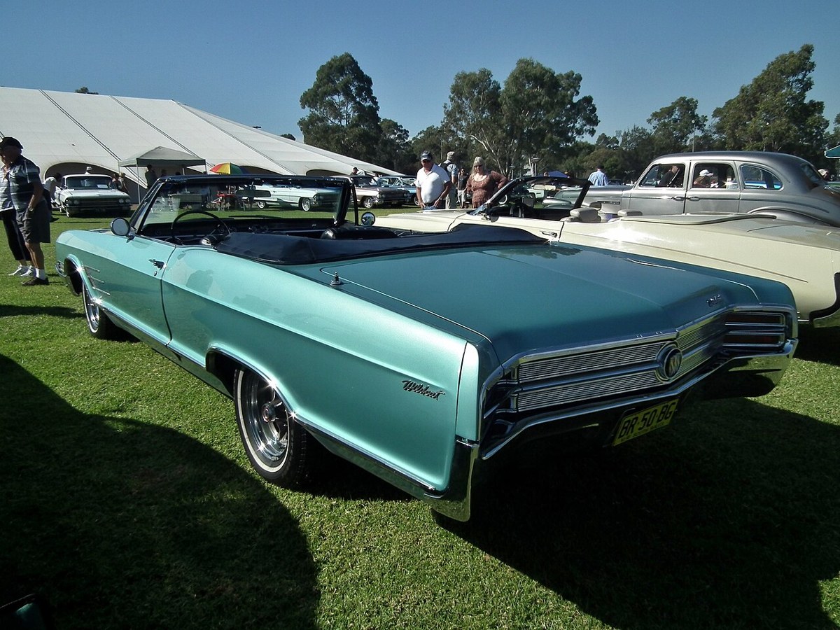 Turquoise 1965 Buick Wildcat convertible at a car show