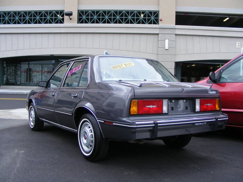 Rear and side of a gray 1982 Cadillac Cimarron