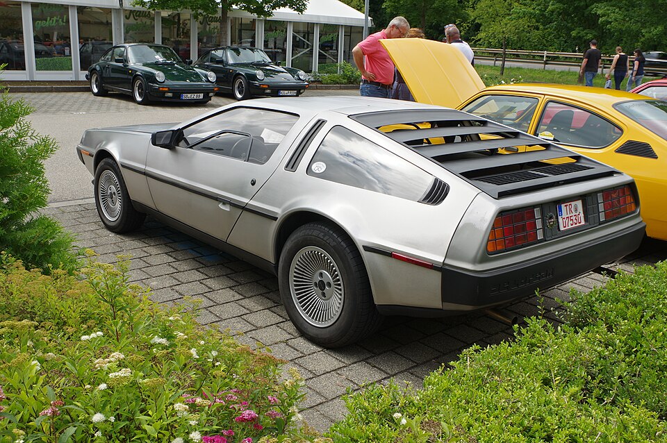Rear three-quarter view of a stainless-steel DeLorean DMC-12