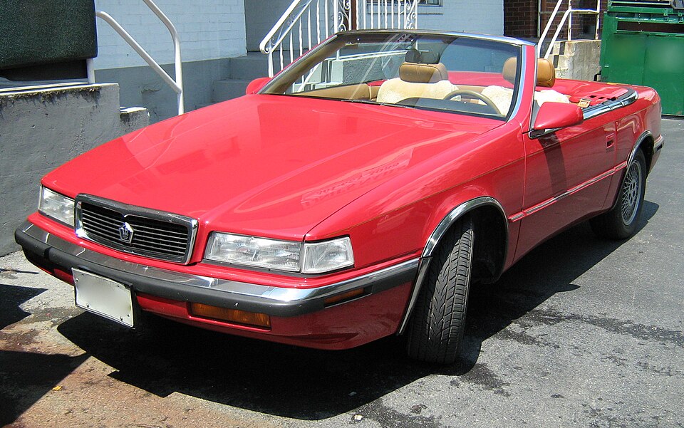 Red Chrysler TC by Maserati with its soft top lowered