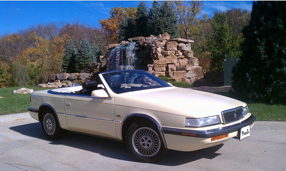 White Chrysler TC by Maserati viewed from the front and side