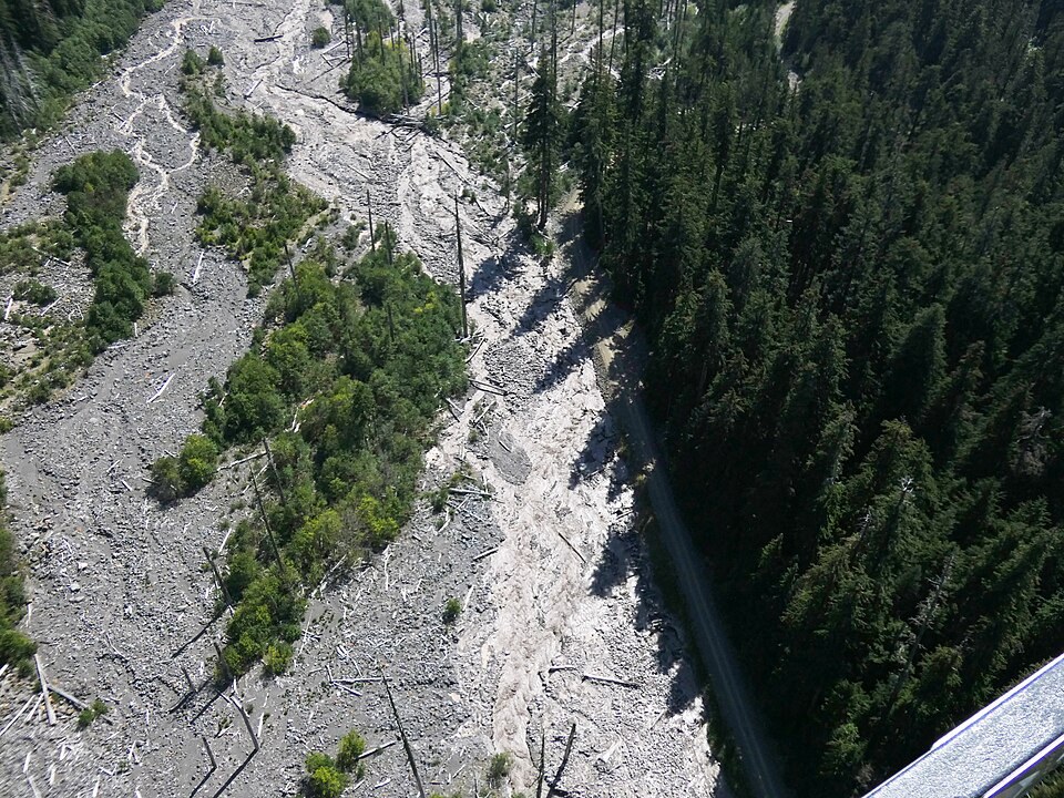 Revetments and erosion along Westside Road show why keeping the entire route open became a losing battle.